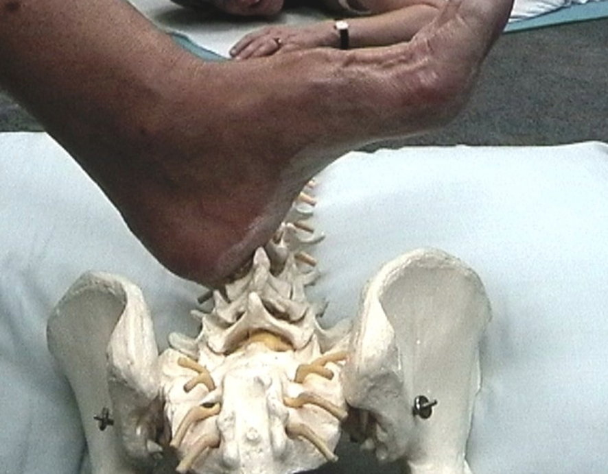 Sarah Key demonstrating the heel mobilisation technique on the lumbar spine