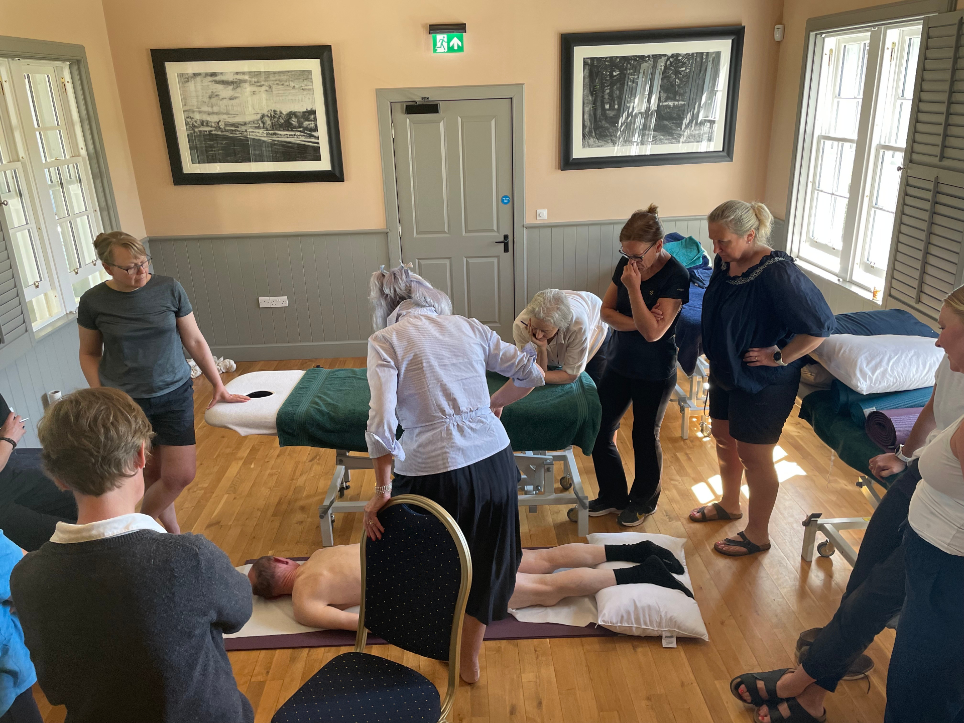 Spinal Masterclass practitioners celebrating together after a training course